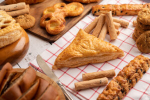 Various breads on red white cloth. Selective focus.